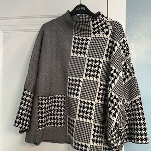 EUC Joseph Ribkoff knot sweater. It has a mock neck and dolman sleeve